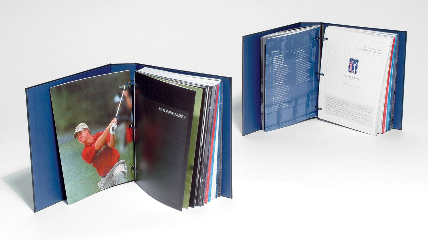 Two printed binders showing the inside of the brand guidelines book for the PGA Tour