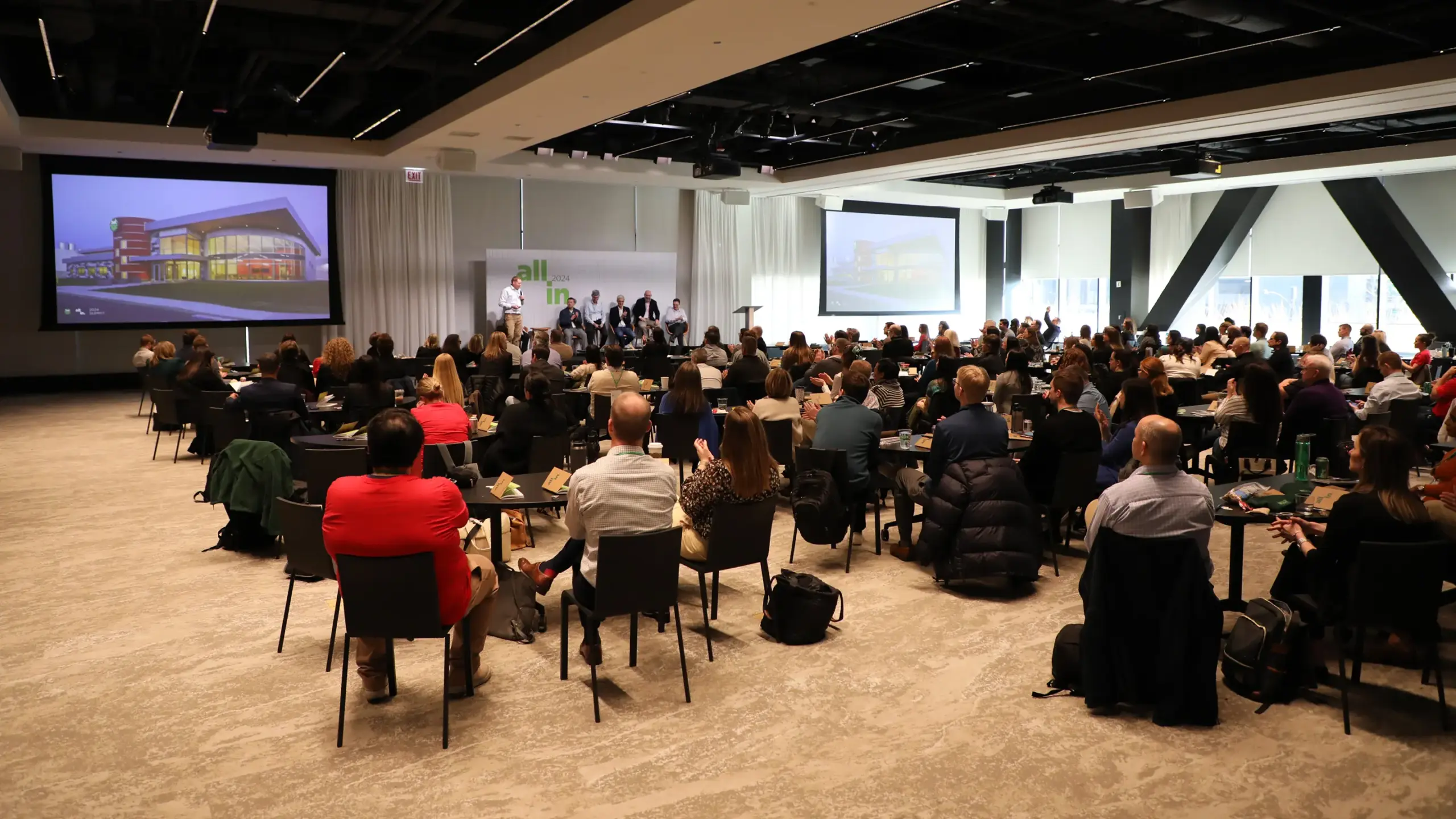 The audience listening to a presentation at All In 2024