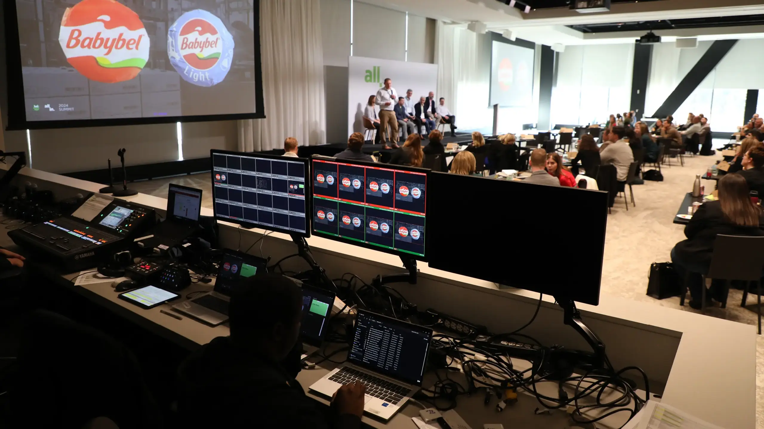 Behind the scenes of the video and sound board at the All In 2024 Summit