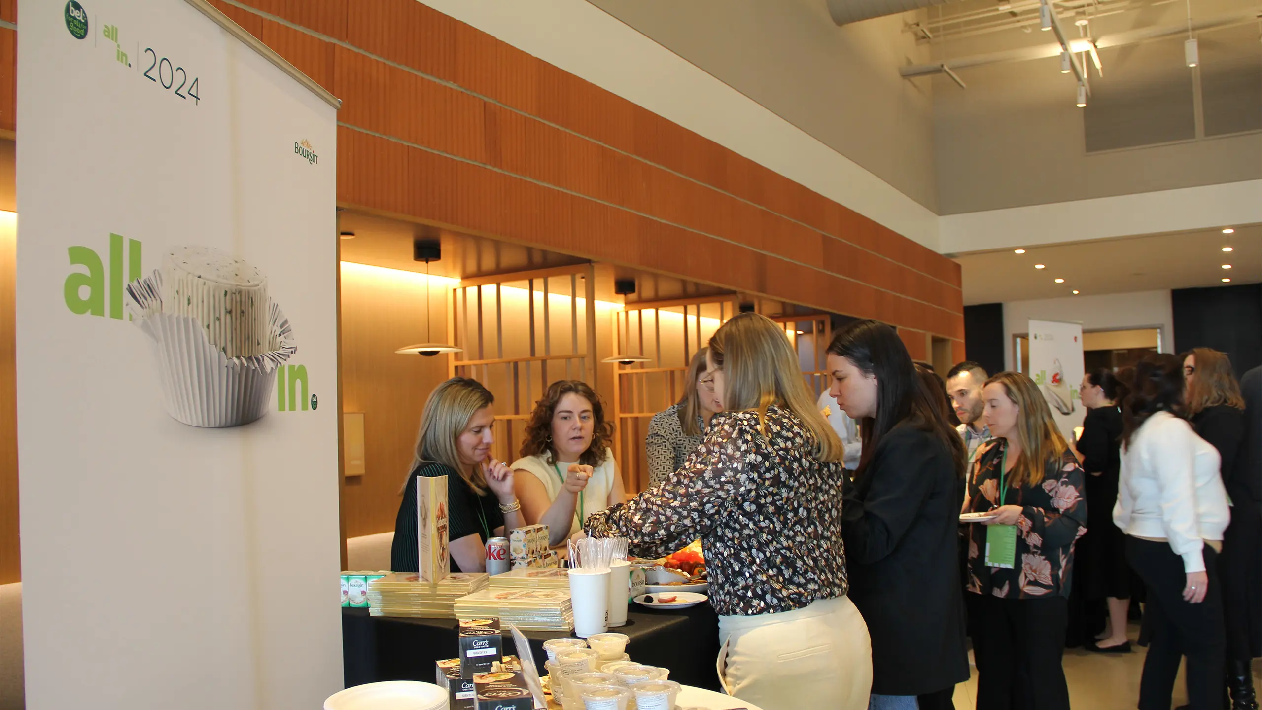 People surrounding a sample booth of Boursin cheese at ‘All In 2024’