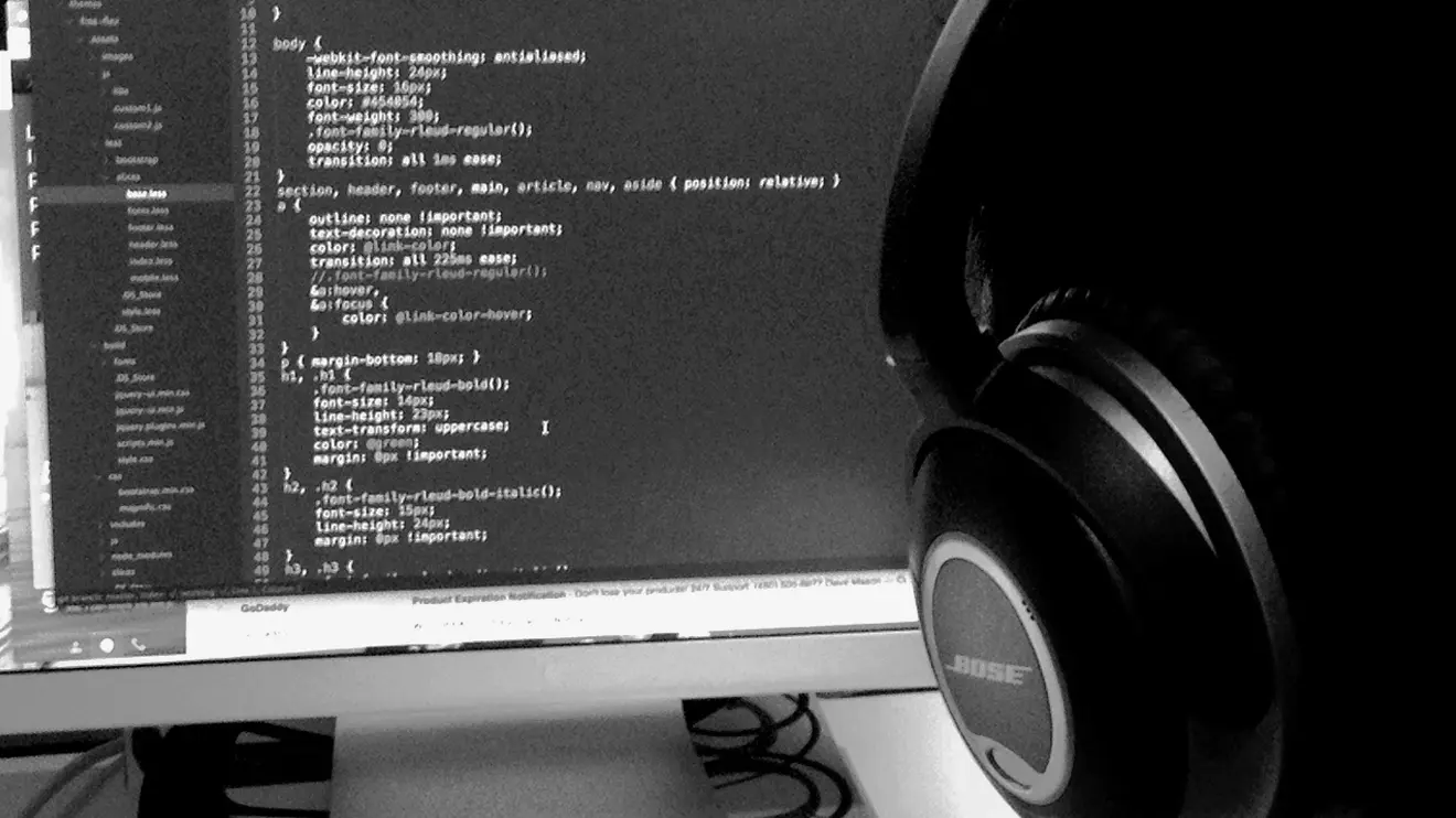 An over the shoulder angle of a developer working and coding