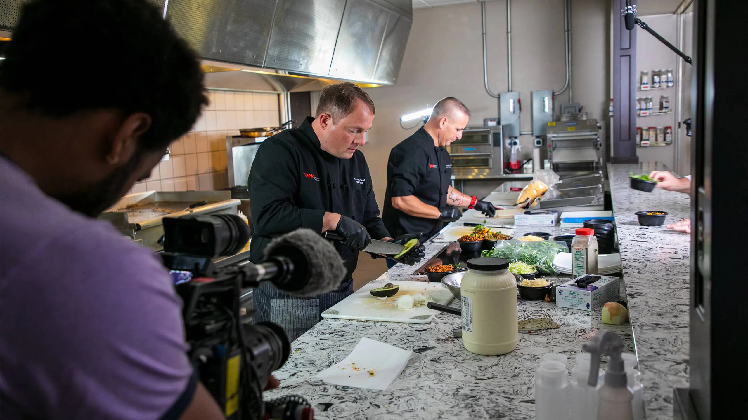 Chefs in action preparing food for FreshTakes