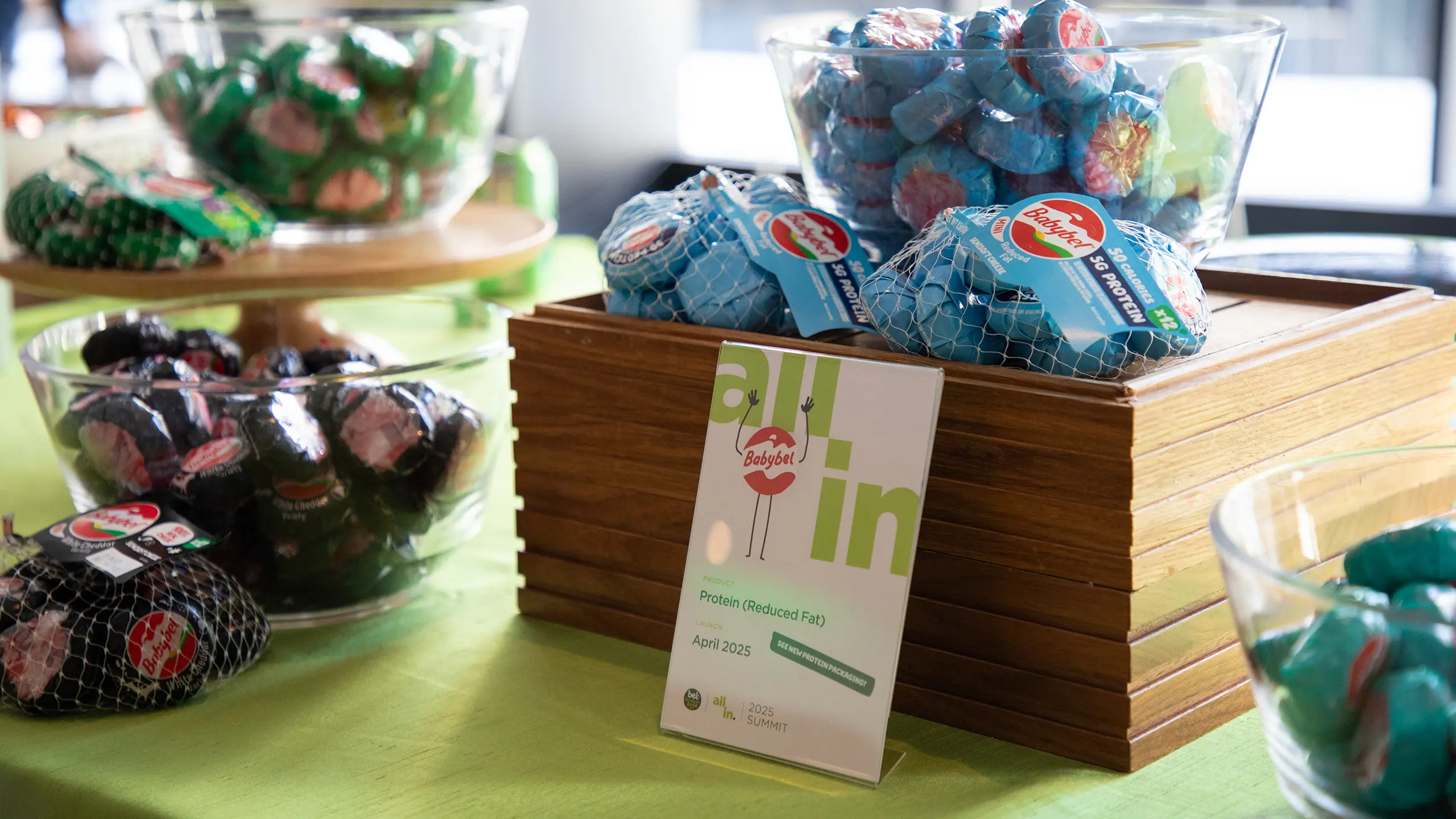 Display of Mini Babybel cheeses on a table at the ‘All In 2025’ leadership summit