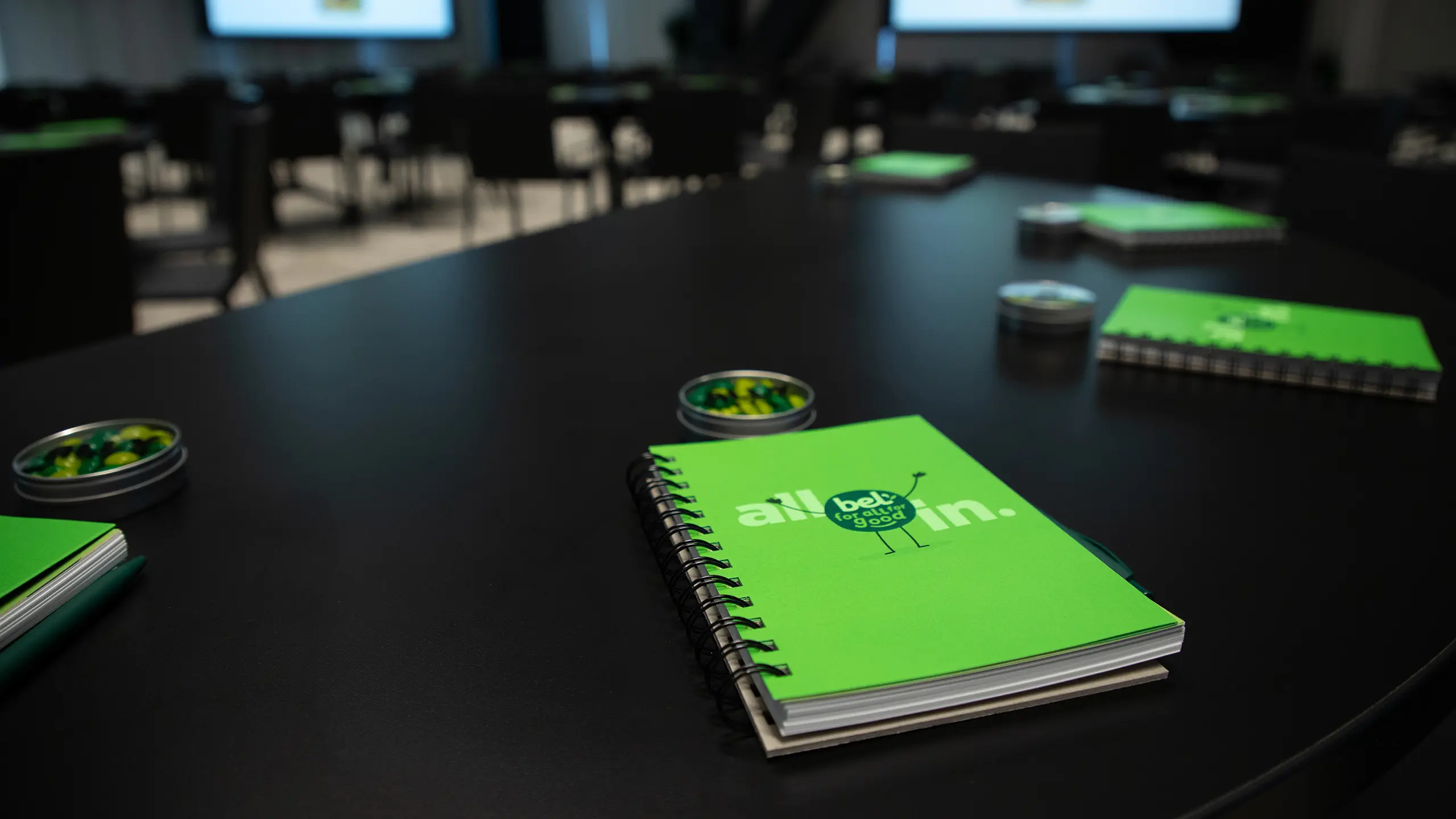 Notebooks on a table at the ‘All In 2025’ leadership summit