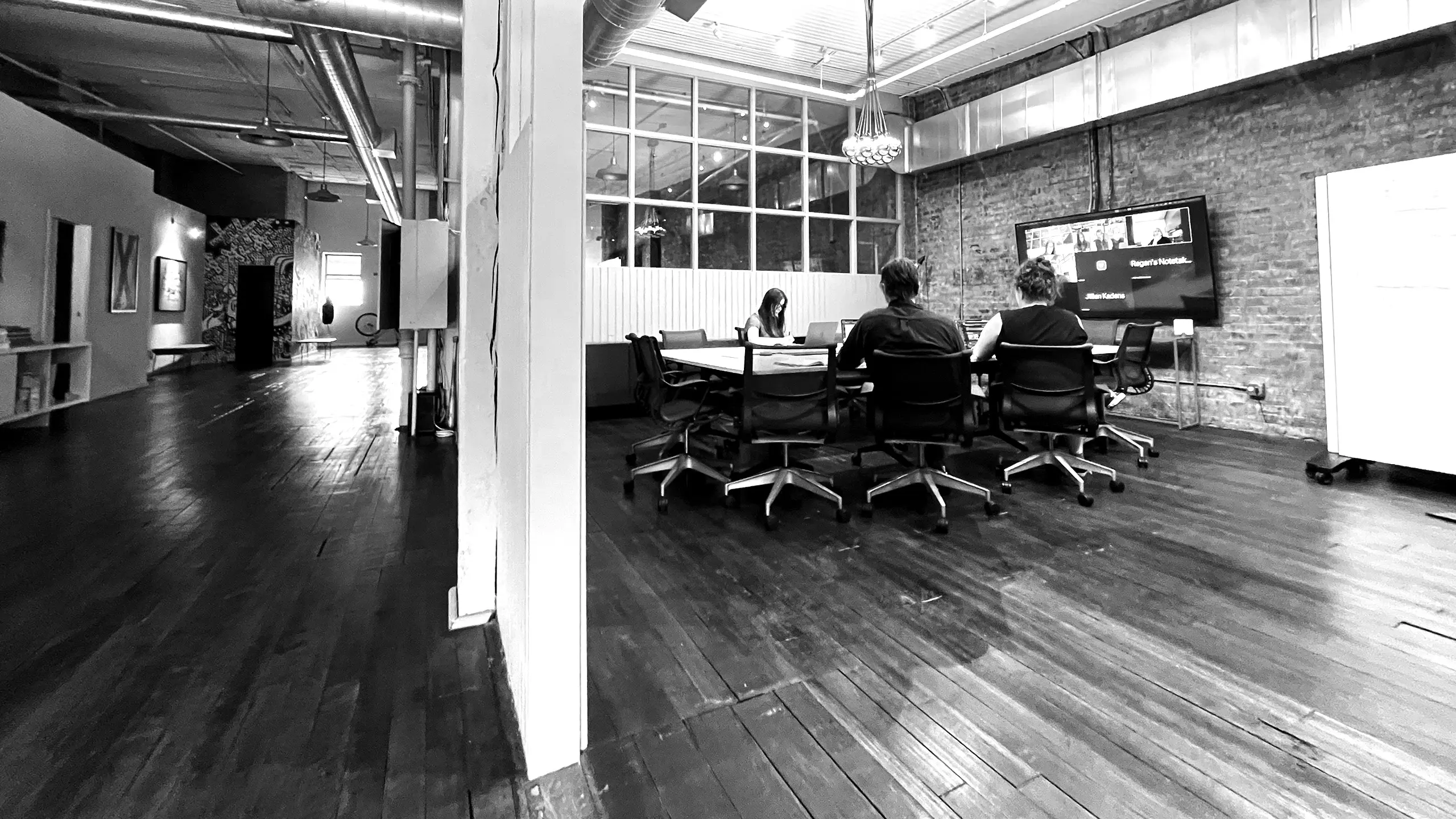 The Multiple team gathering in the main conference room for a brainstorming and strategy session