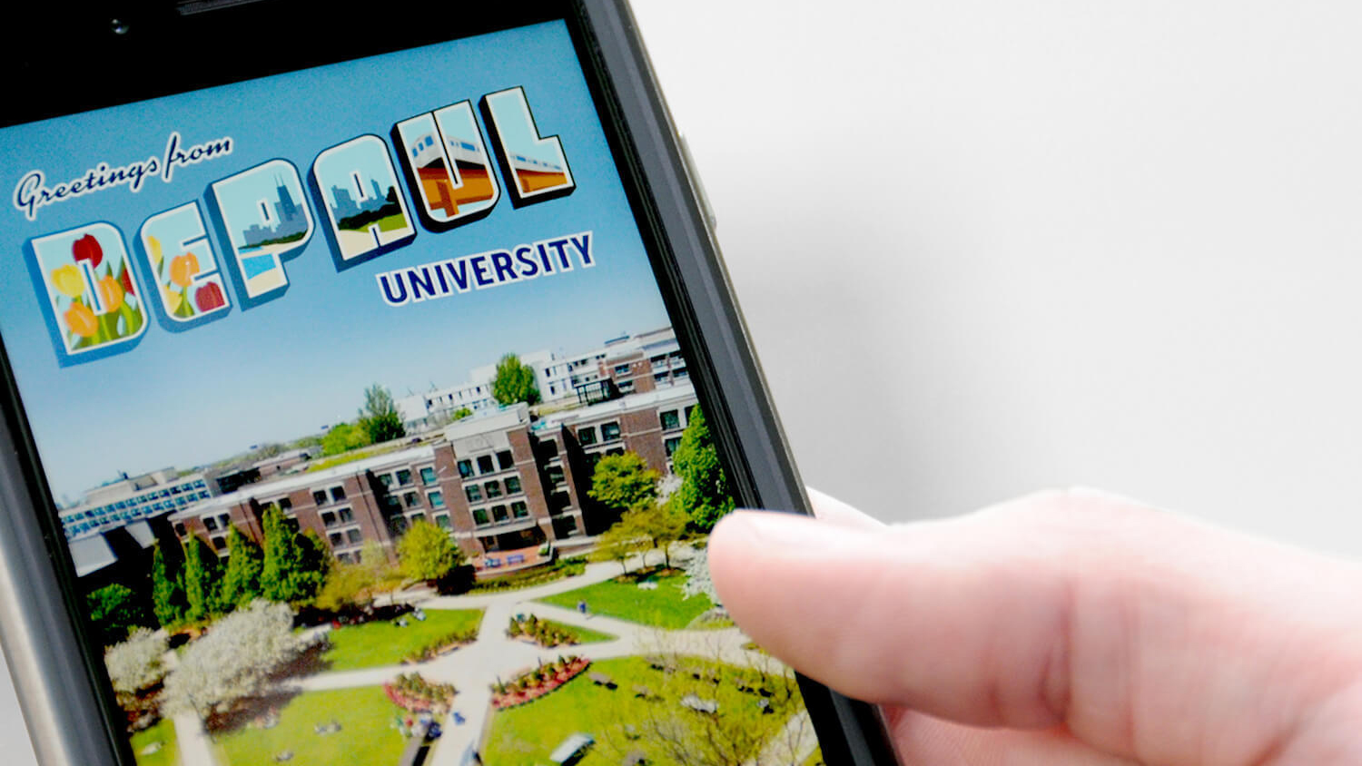 A smartphone displays a vibrant "Greetings from DePaul University" postcard, showcasing a sunny campus scene with lush greenery and brick buildings.
