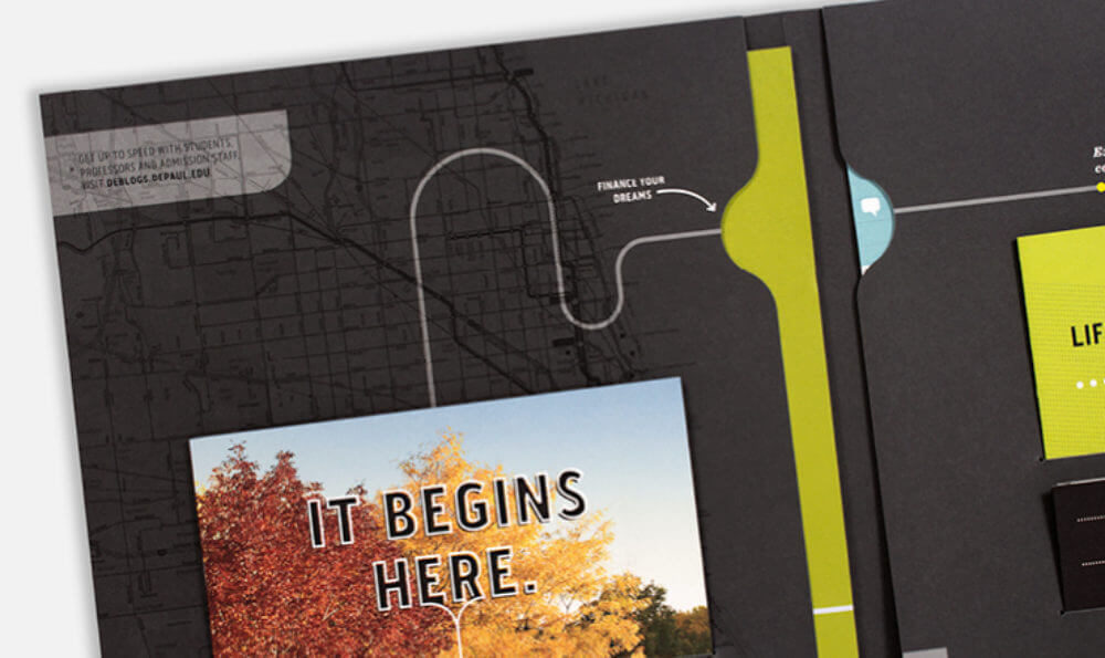 A black brochure with yellow-green accents with an autumn tree photo and the words 'It Begins Here.' A map with highlighted paths indicates journeys, suggesting direction and planning.