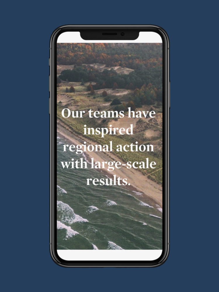 Smartphone displaying aerial view of a coastline with waves and lush greenery. Text reads, "Our teams have inspired regional action with large-scale results."