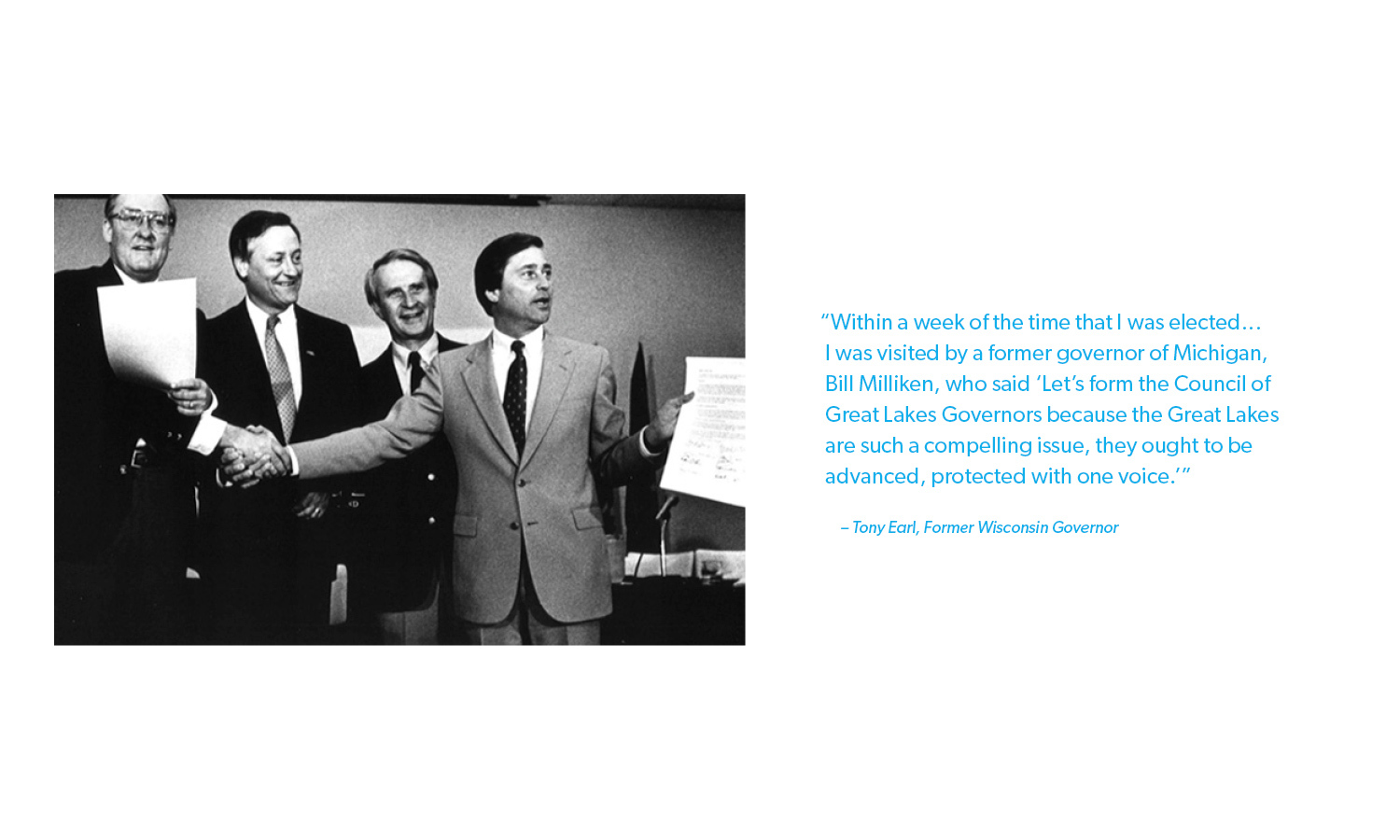 Black and white photo of four men in suits. They are smiling; one holds papers. Quote on the right about forming the Council of Great Lakes Governors.